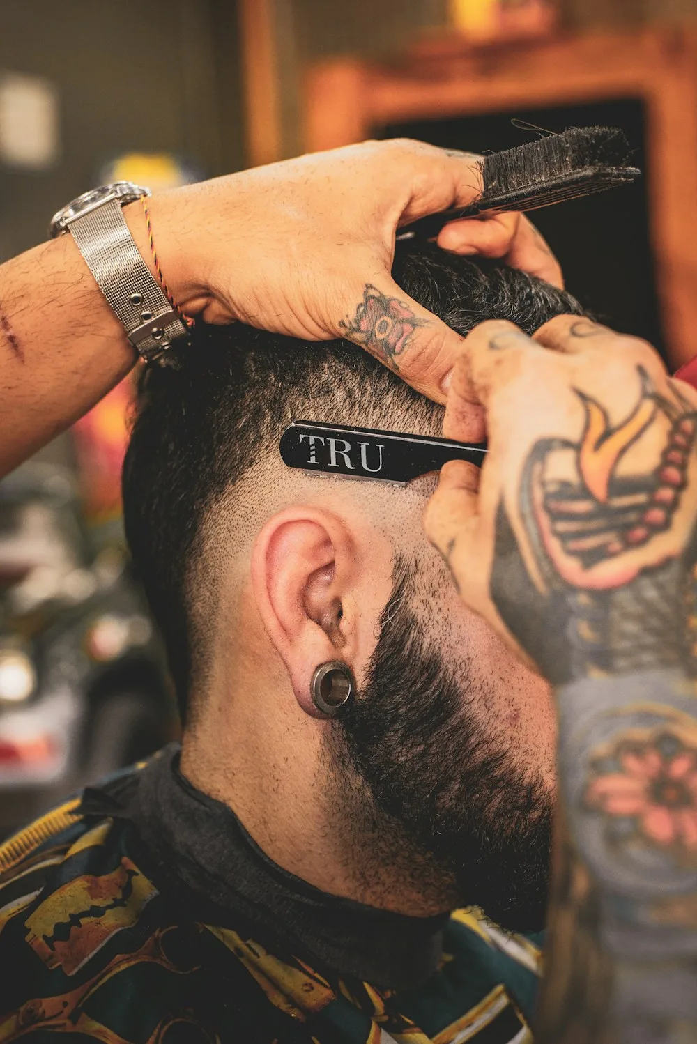 Close-up of a precise skin fade being lined up