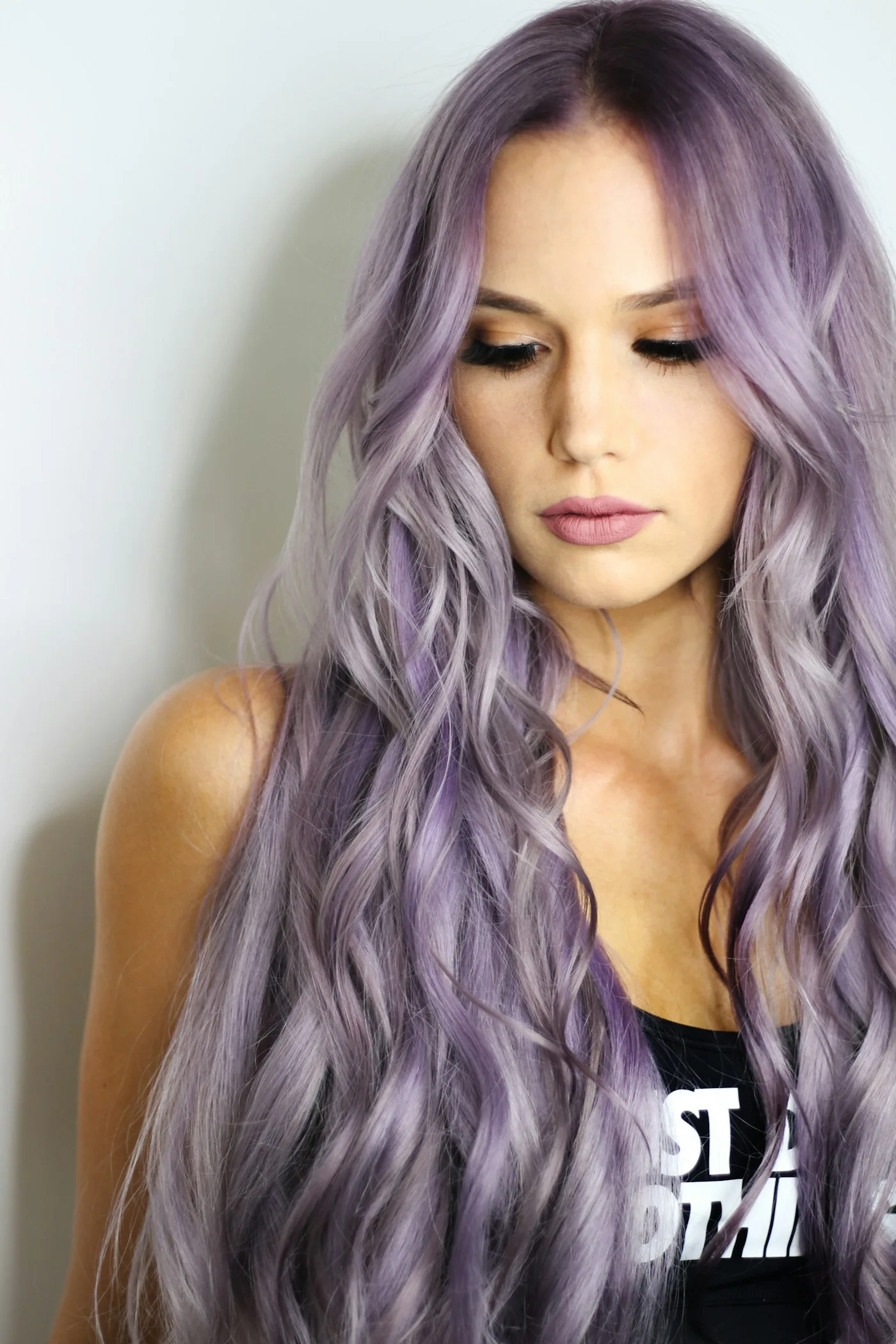 Woman with a finished pastel colour and waved styling